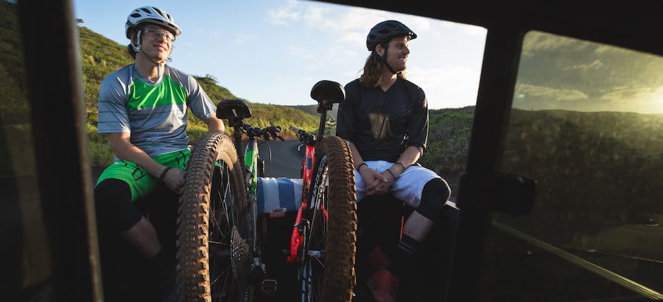 Specialized bike riders with their bikes in the back of a truck