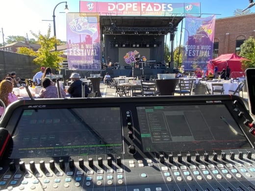 Allen & Heath Avantis console at front of house facing the Taste of Soul stage in daylight, with guests at tables