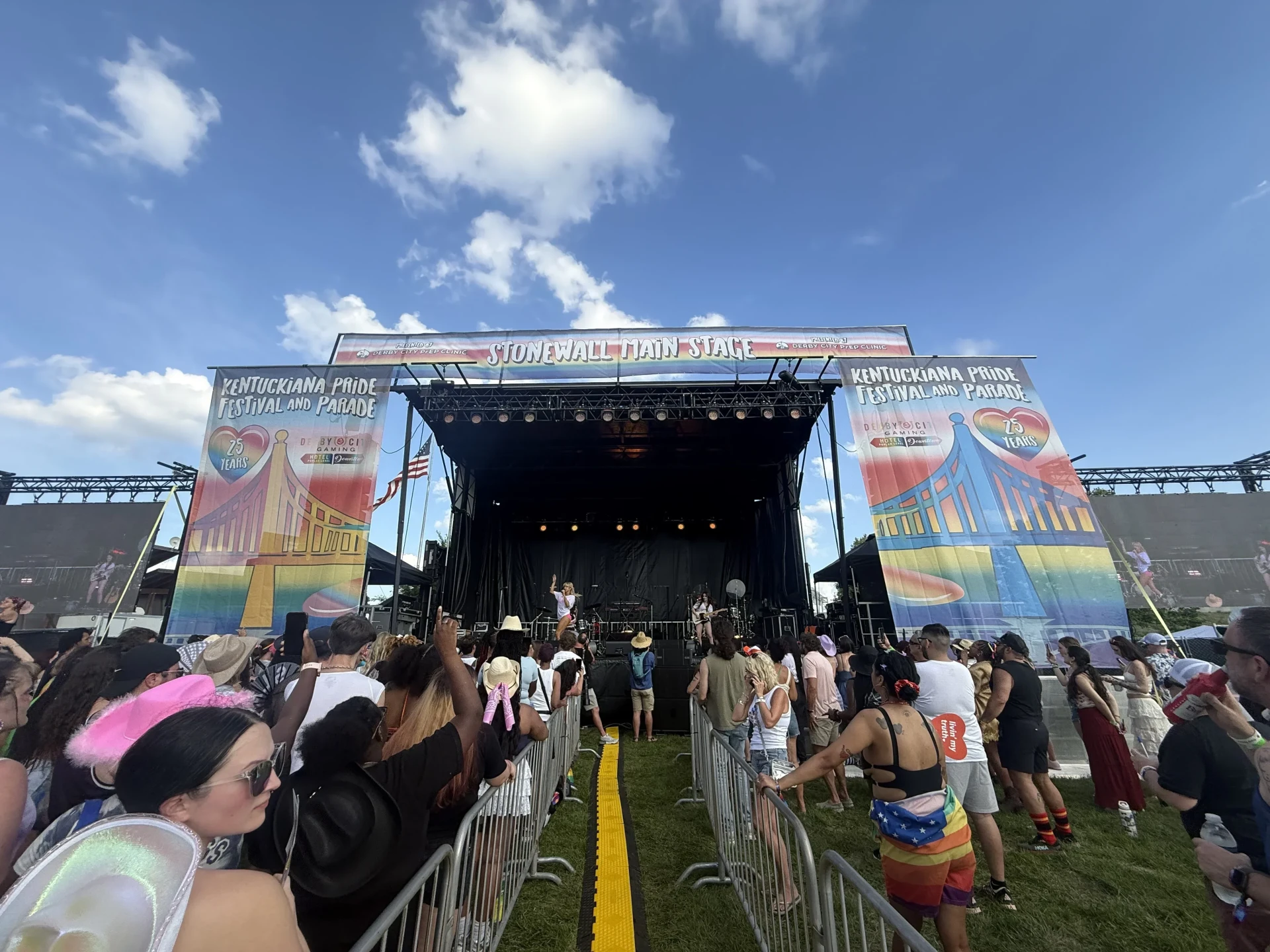 Outdoor concert stage rental with full line array and lighting at Kentuckiana Pride Festival