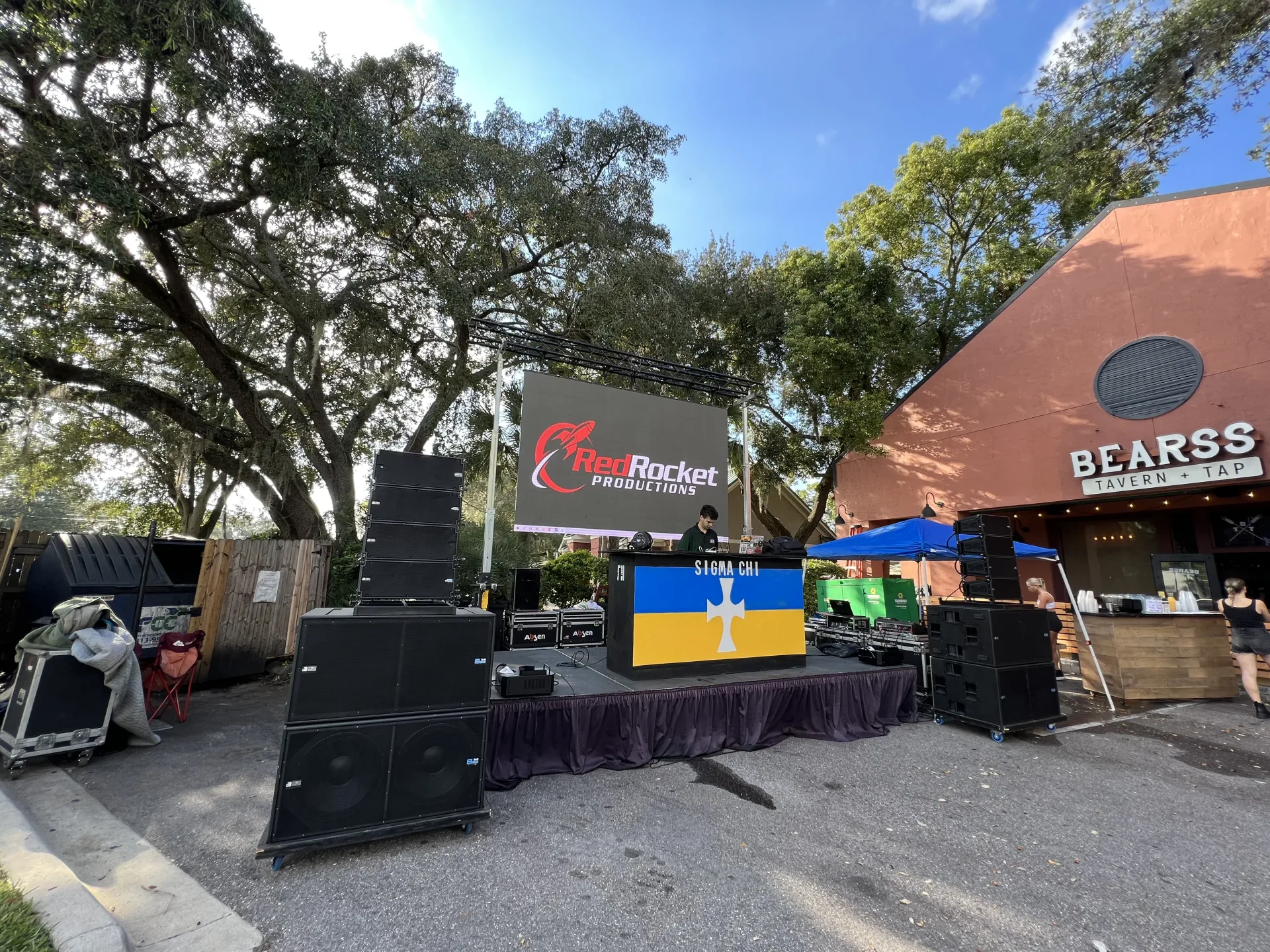 Outdoor campus concert with LED video wall, stage, and truss lighting