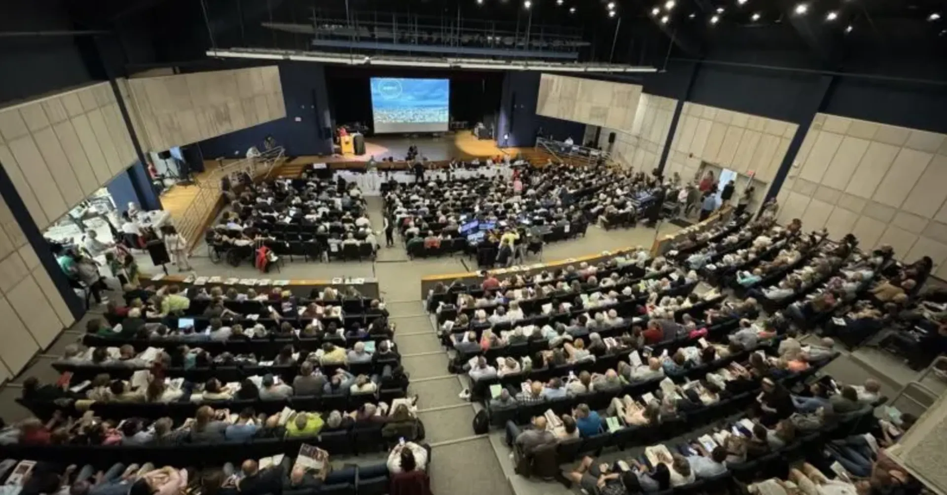 Town hall event with staging and professional audio for public forums