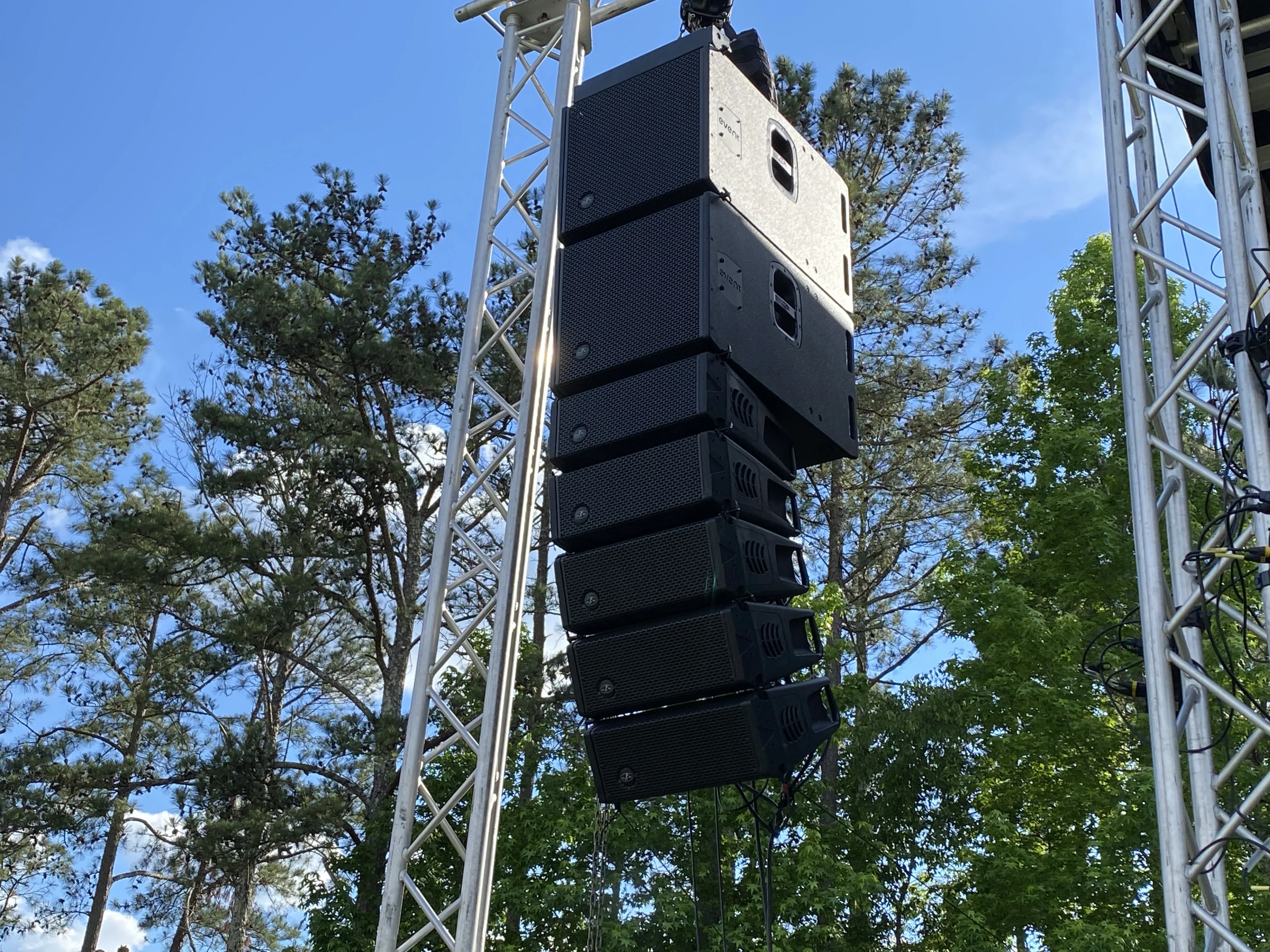Touring-grade audio rental inventory — flown line array PA at a concert