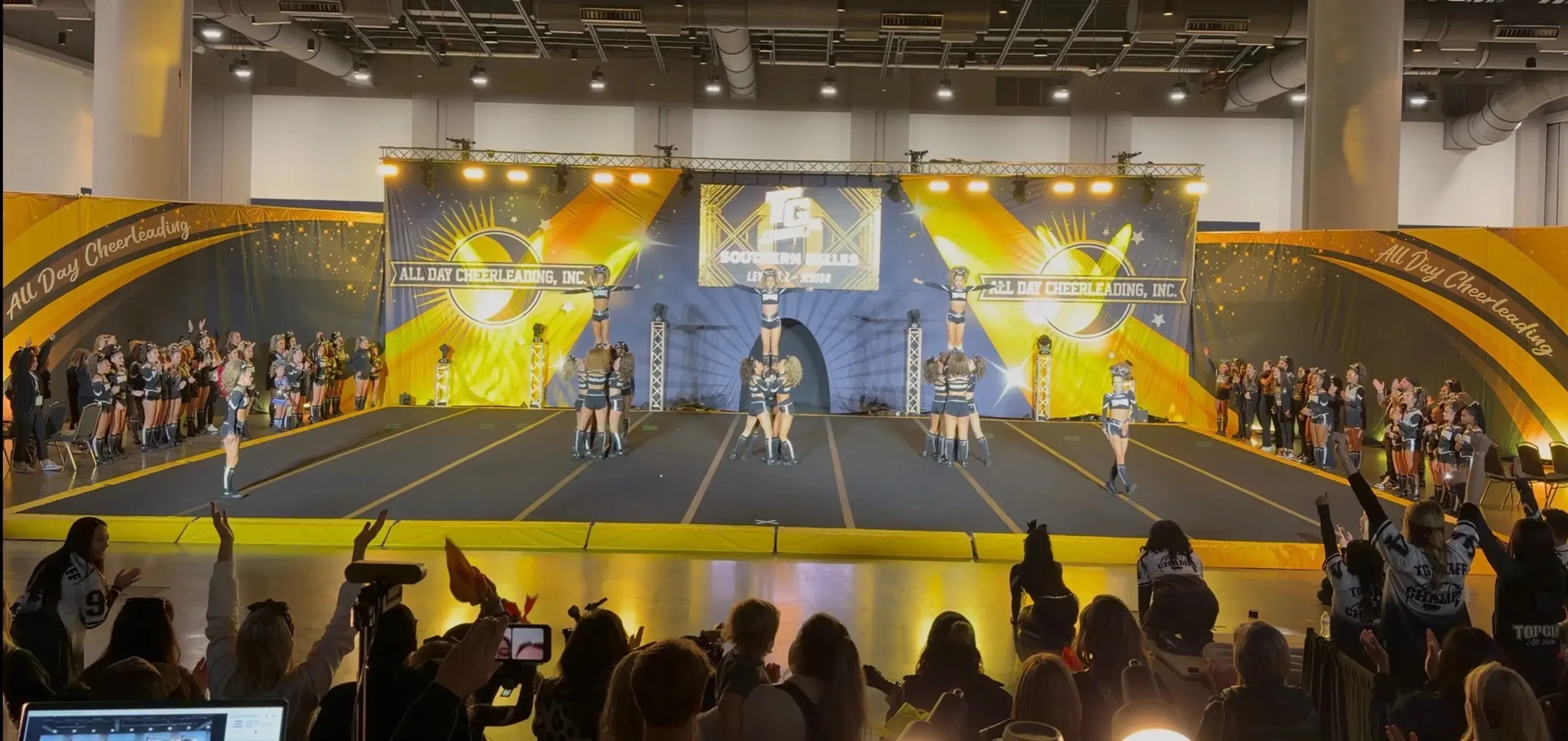 Cheer competition production with full stage, lighting, and LED setup
