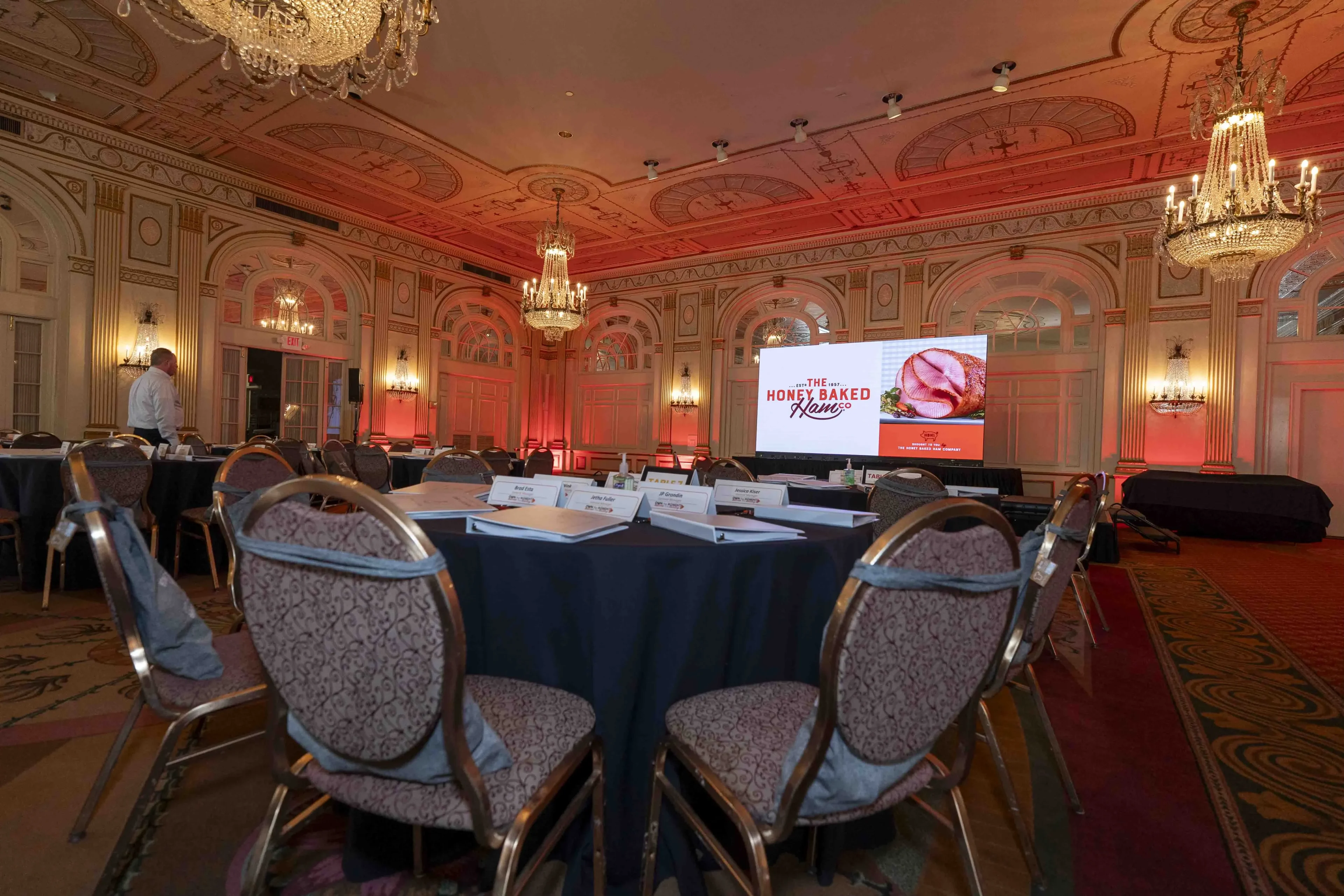 Corporate award gala with crystal chandelier and theatrical lighting
