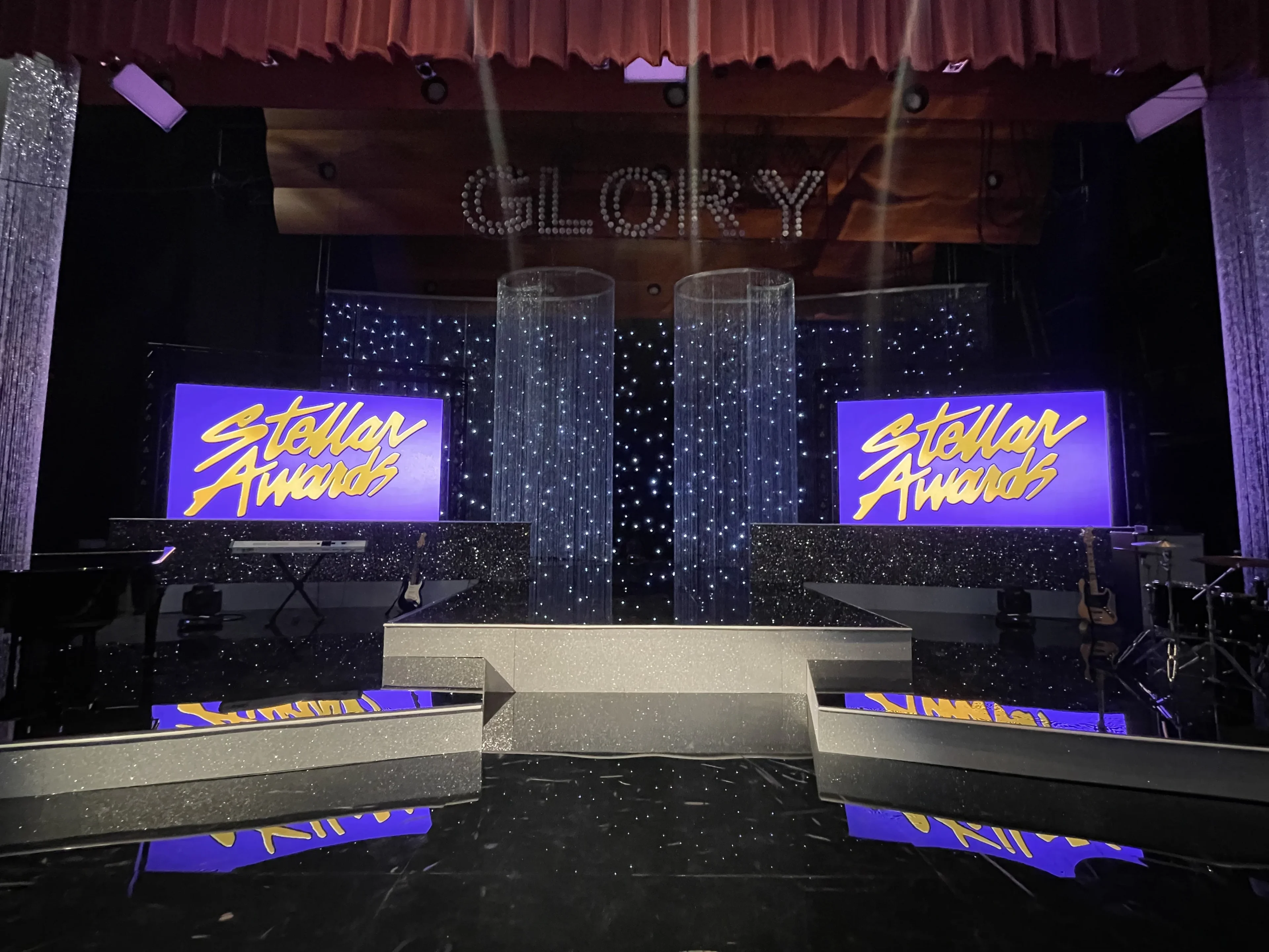 Award ceremony stage with dual LED walls, sparkle curtains, multi-level staging, and Glory signage for church production