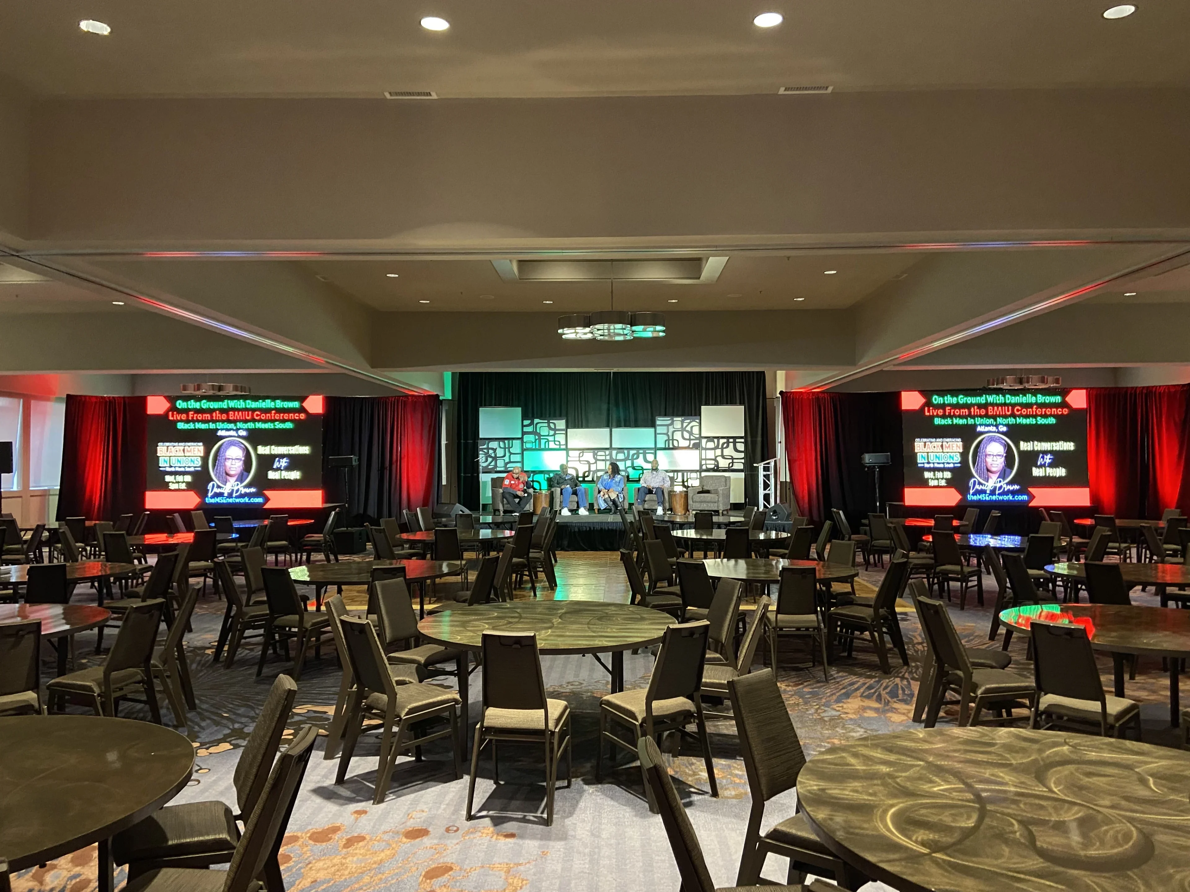 Ballroom event with professional lighting and LED wall