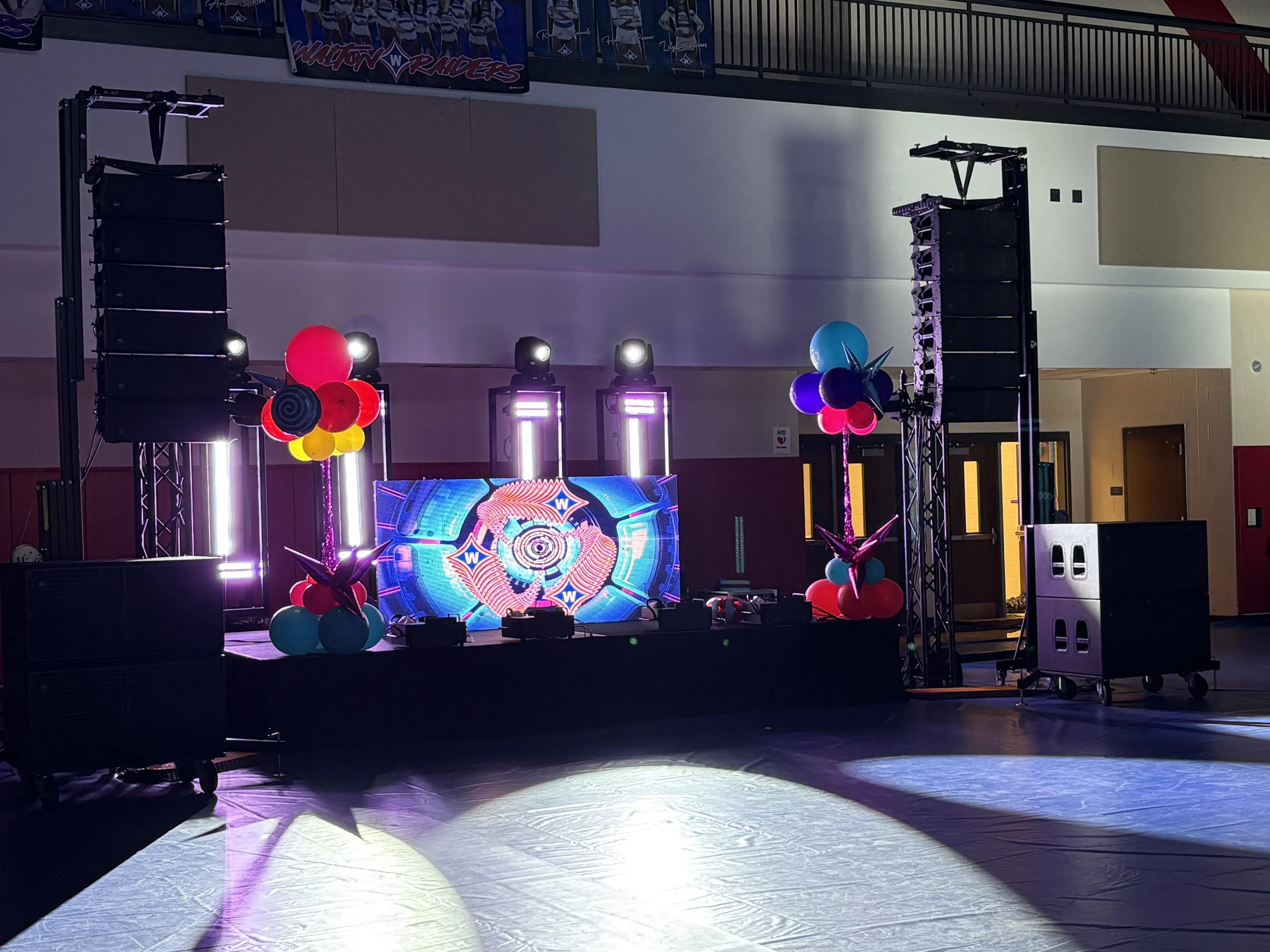 Dual flown PA arrays at outdoor concert venue