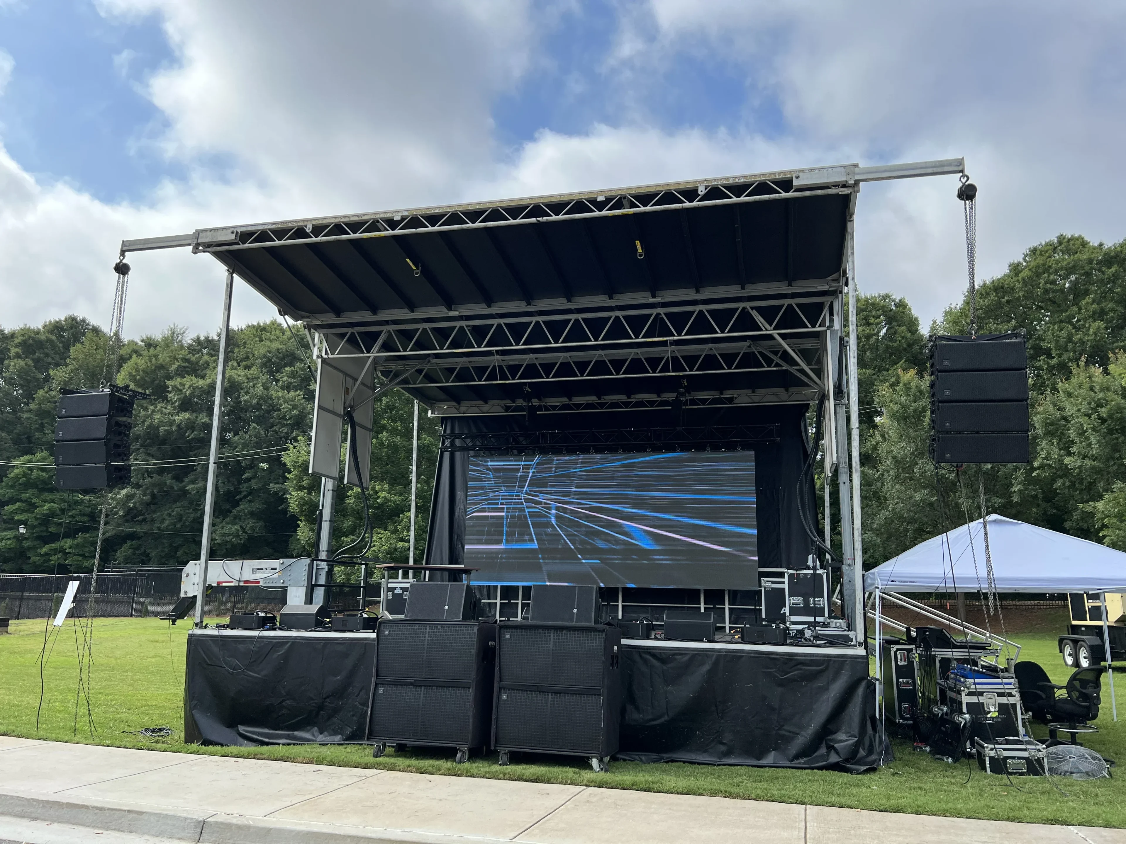 SL100 mobile stage with LED wall and line array setup
