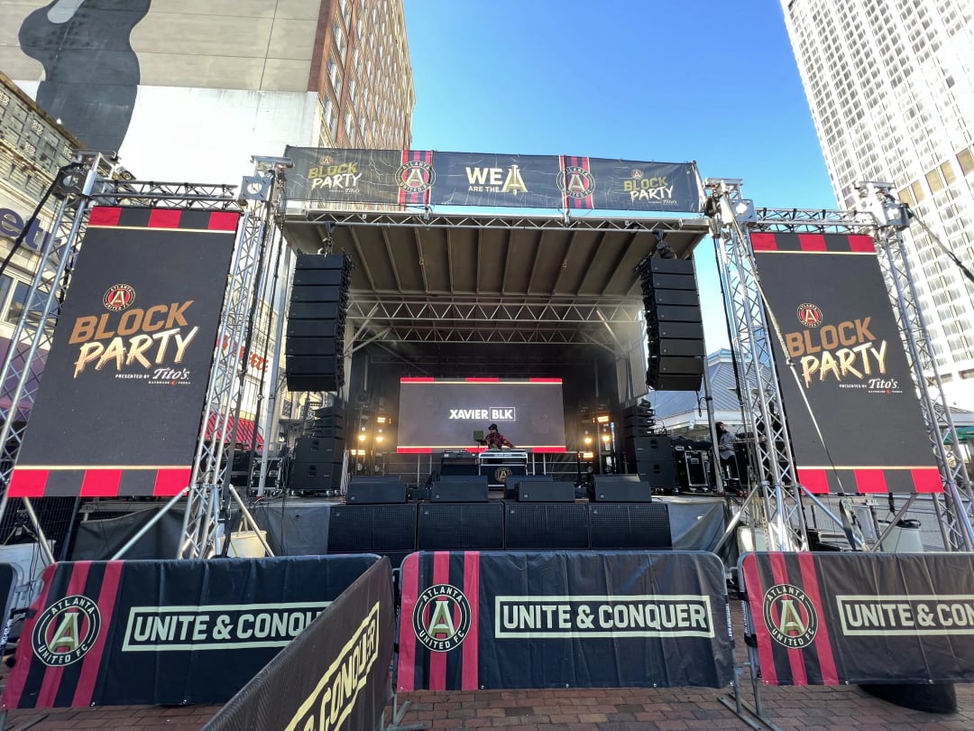 Outdoor festival stage with LED video walls on truss
