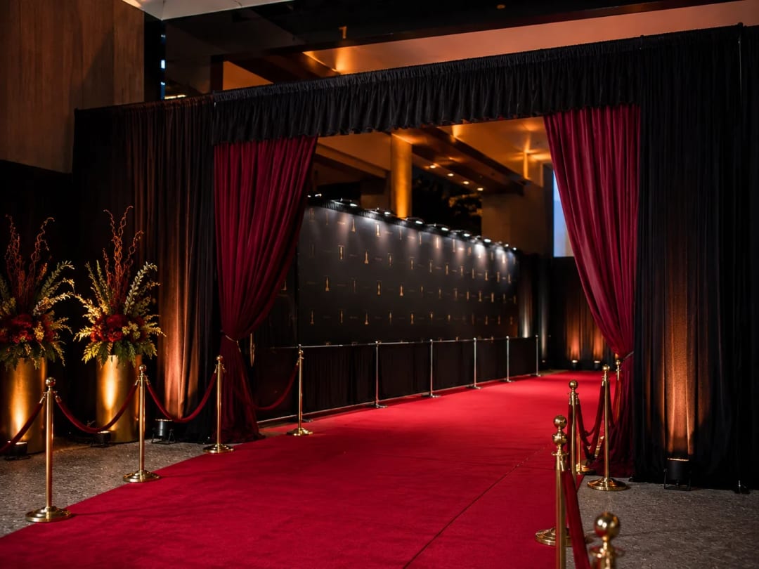 Event drapery finished with warm uplighting at an Atlanta event