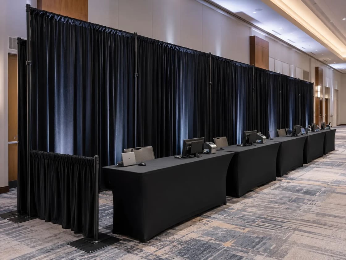 Full-height pipe and drape backdrop wall set up for an Atlanta event