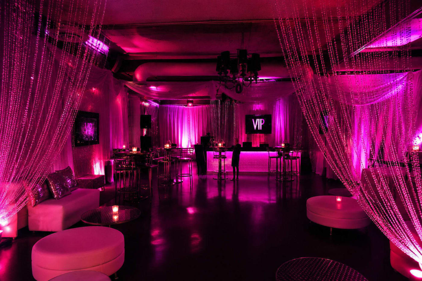 Full-room pipe and drape transformation enclosing an Atlanta event space.