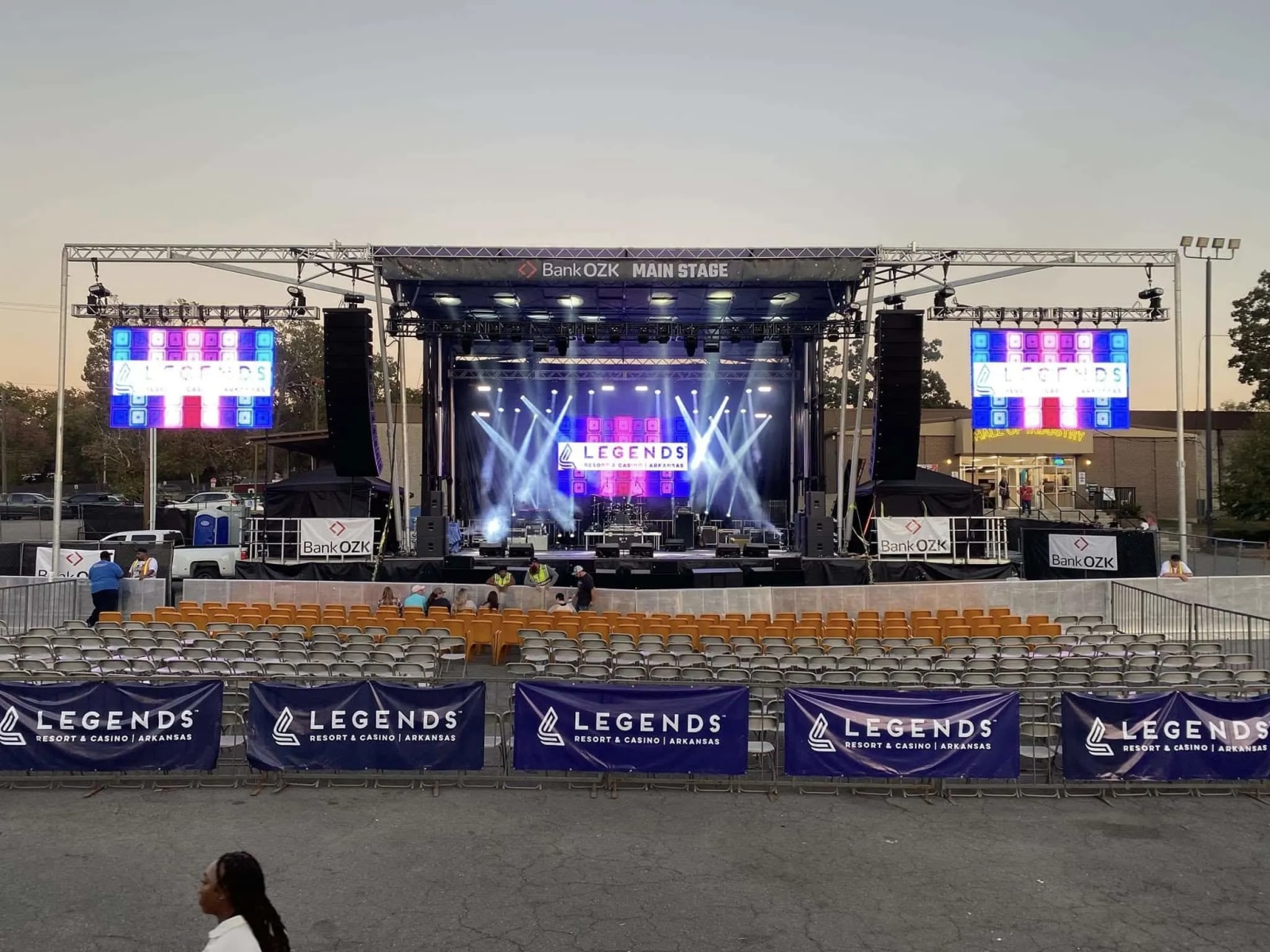 Full-production concert stage with LED walls and IMAG side screens