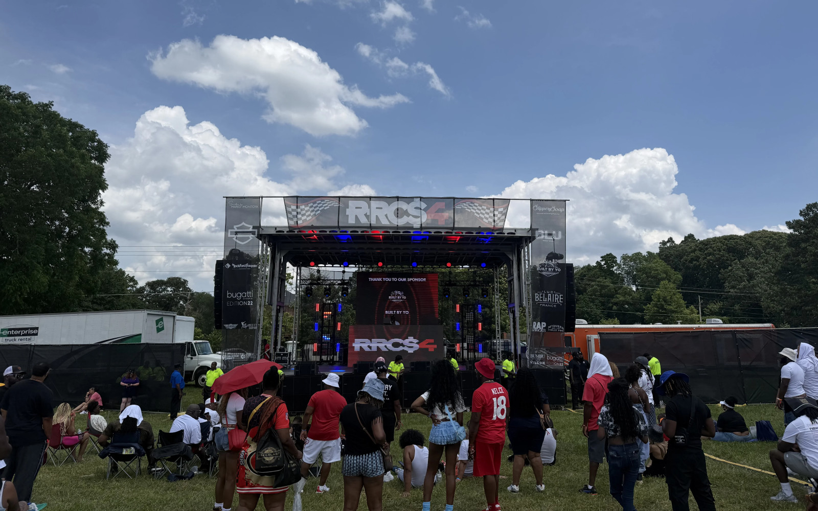 APEX 3224 mobile stage with LED video wall and crowd