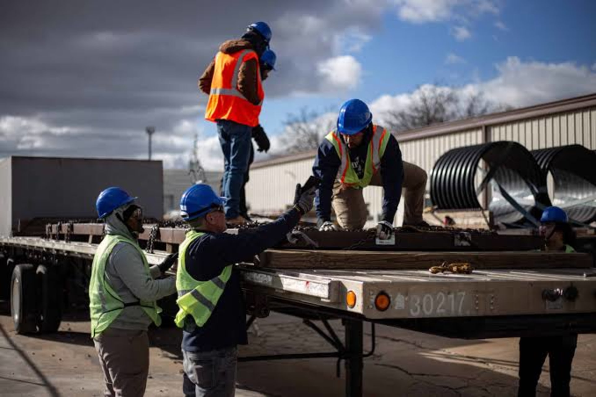 Transferring surplus construction material between two Tampa Bay jobsites