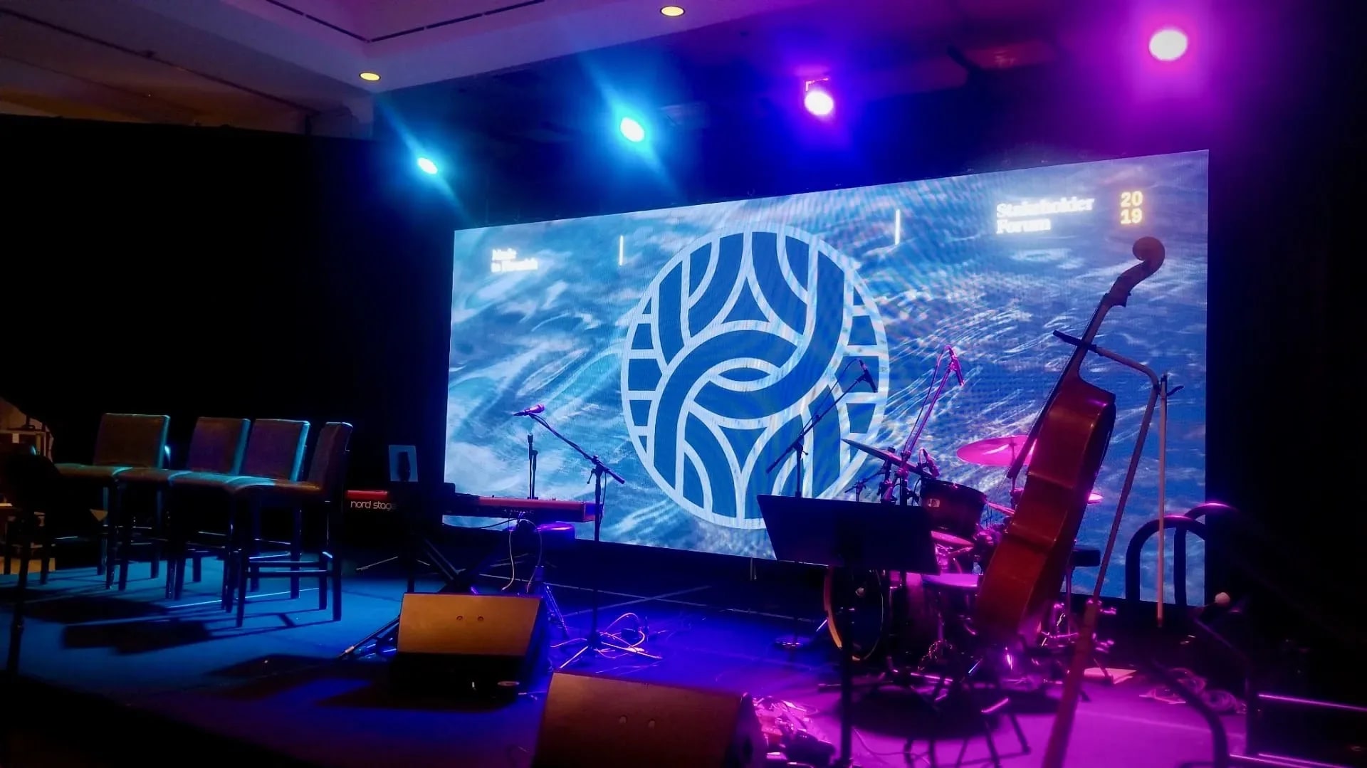 Indoor corporate LED wall and stage setup at an Atlanta venue.
