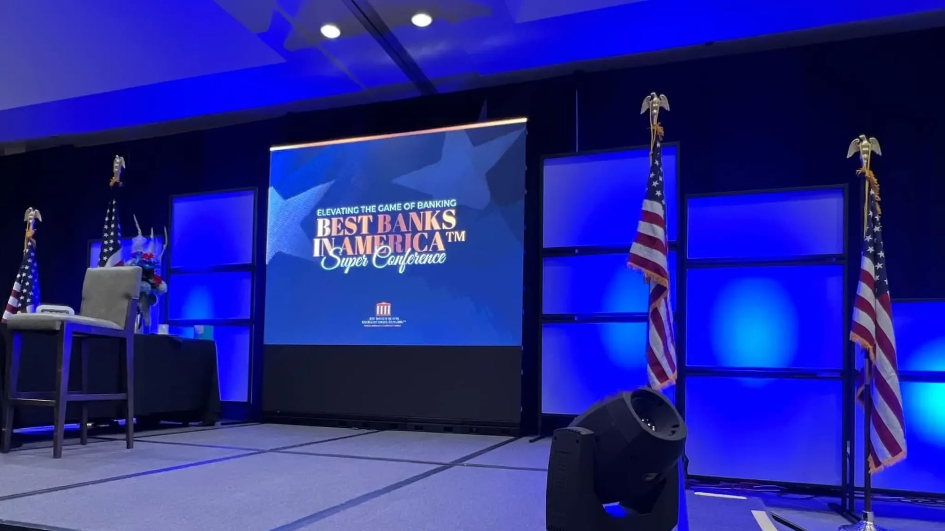 Conference keynote stage with LED video wall array and professional lighting