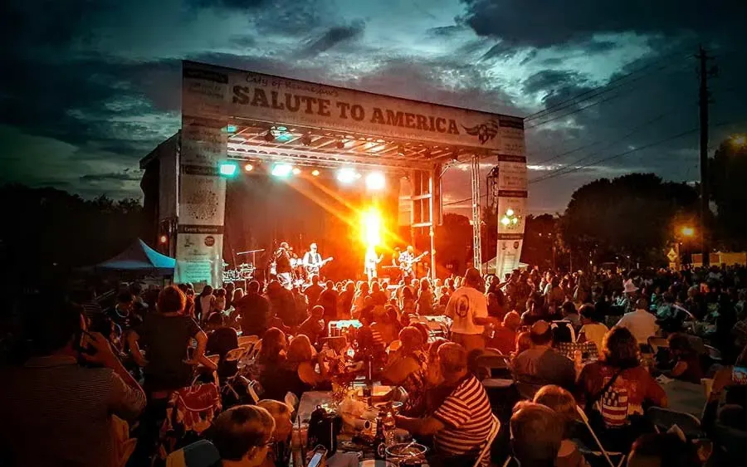 Concert stage production with roof, audio, and LED setup