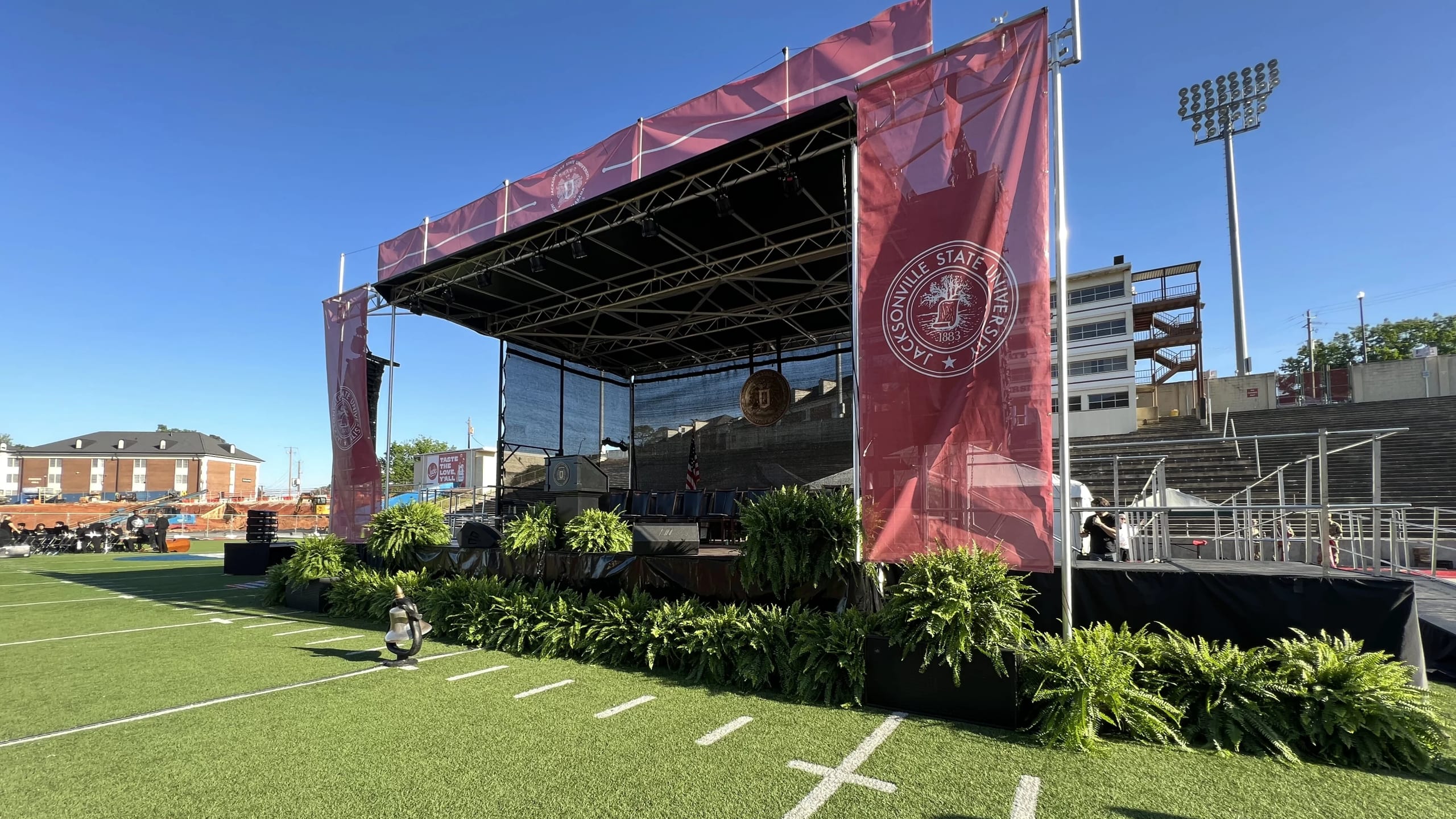 Graduation commencement ceremony with staging, IMAG screens, and live streaming production