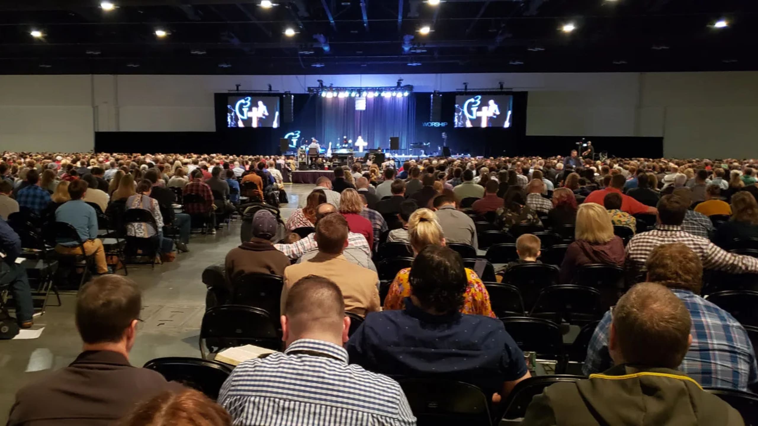 Worship conference production with LED video wall, IMAG screens, staging, lighting, and audio