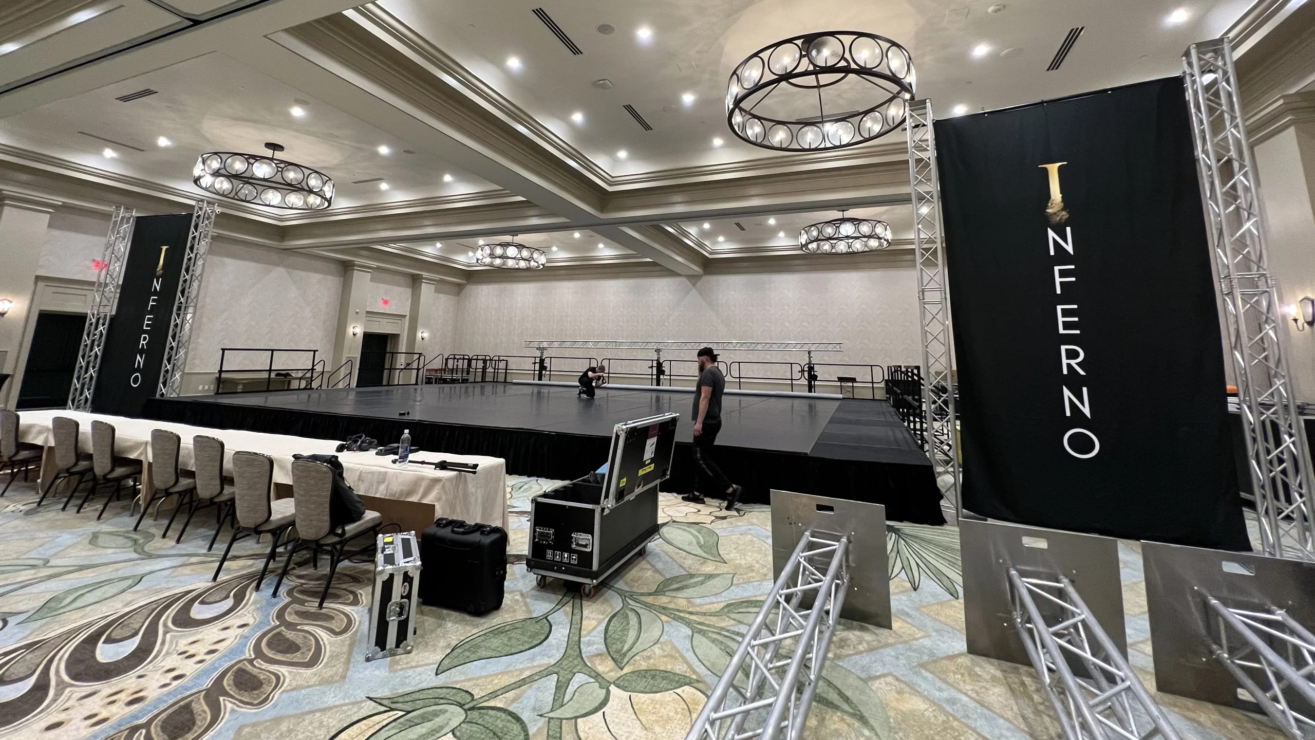 Indoor stage rental with modular 4x8 deck platform staging and accessible access steps for a corporate event
