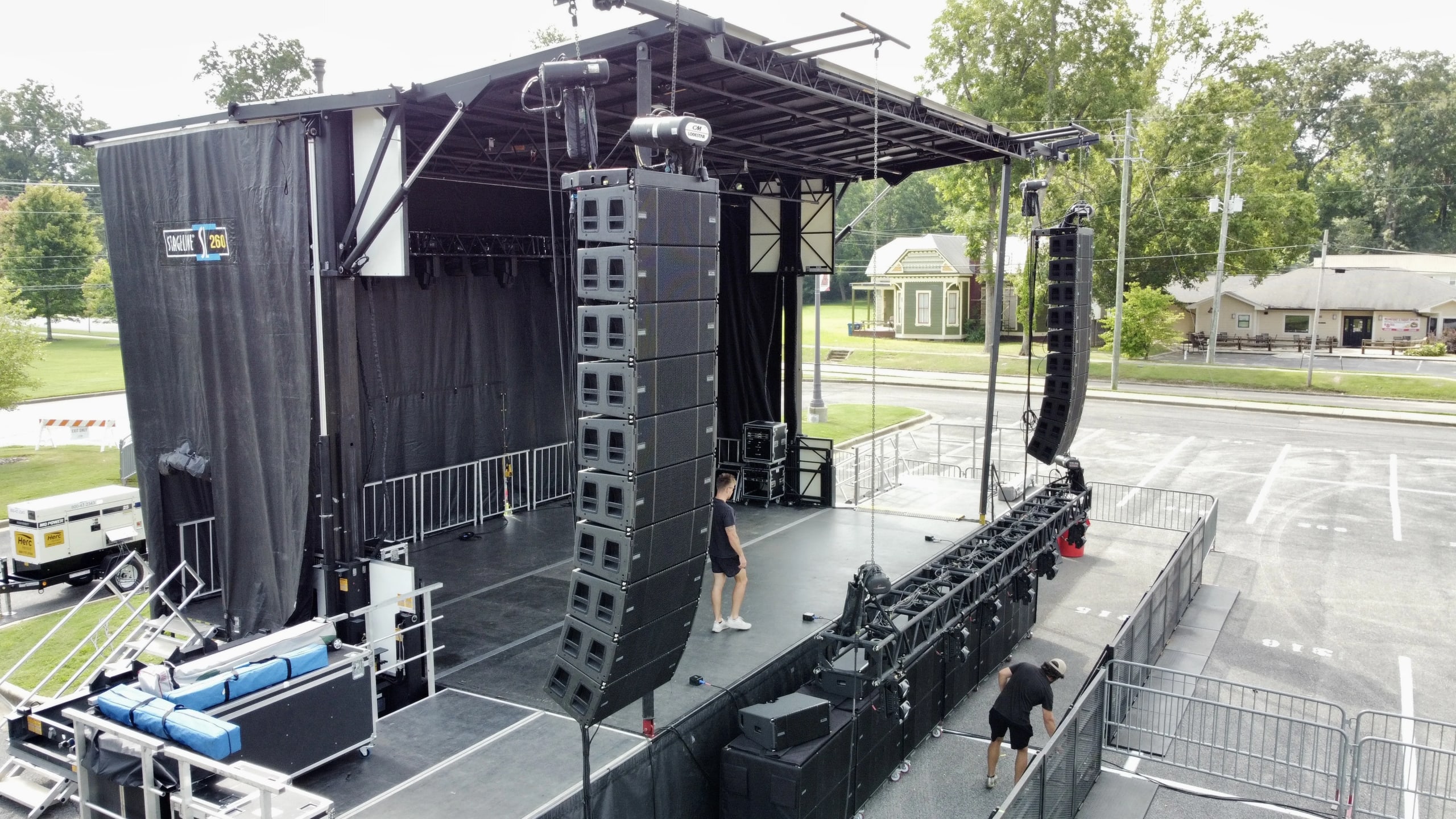 Professional concert audio system with line array speakers at outdoor live music event