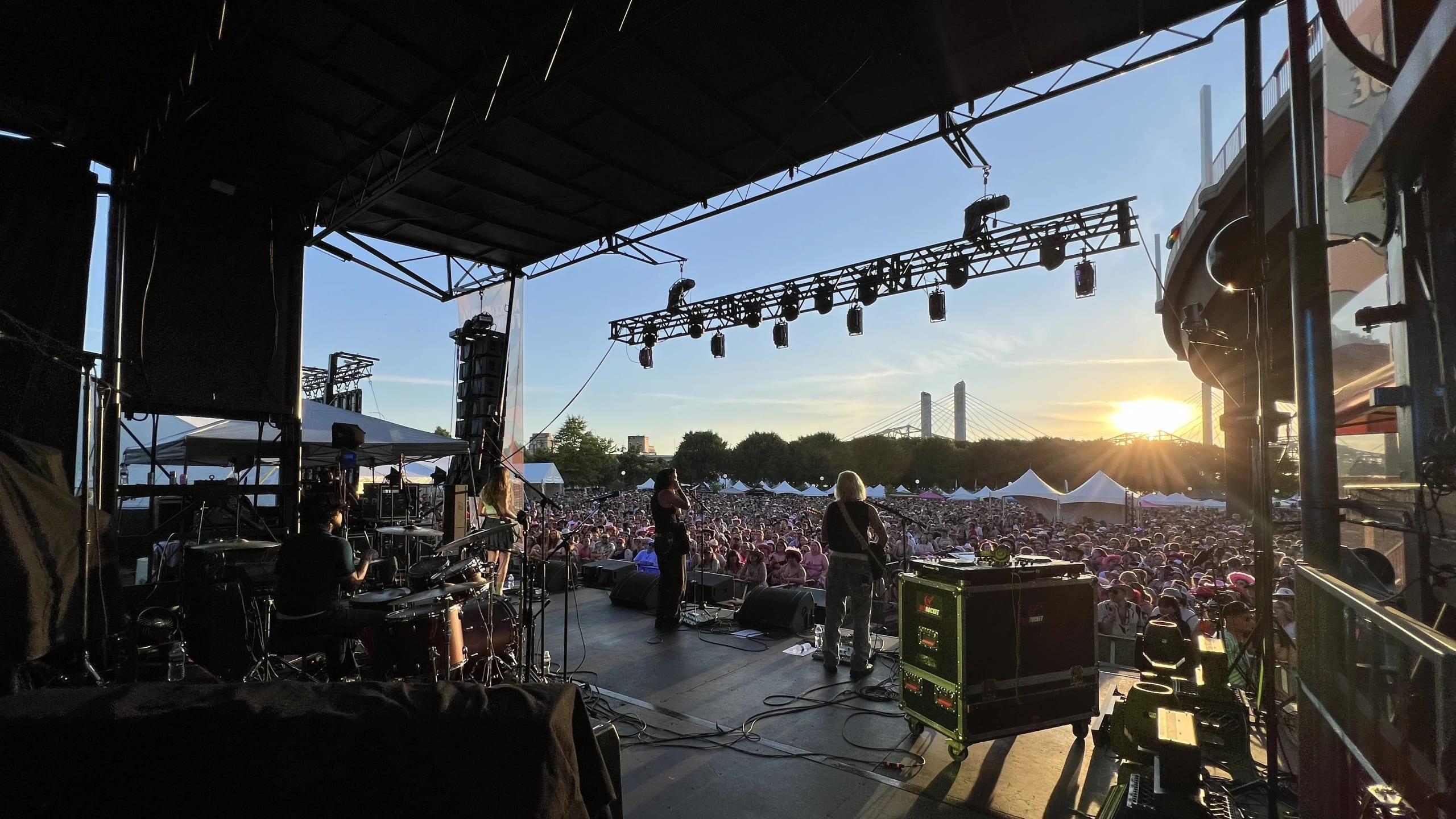 Outdoor concert production with mobile stage, LED video walls, and concert lighting
