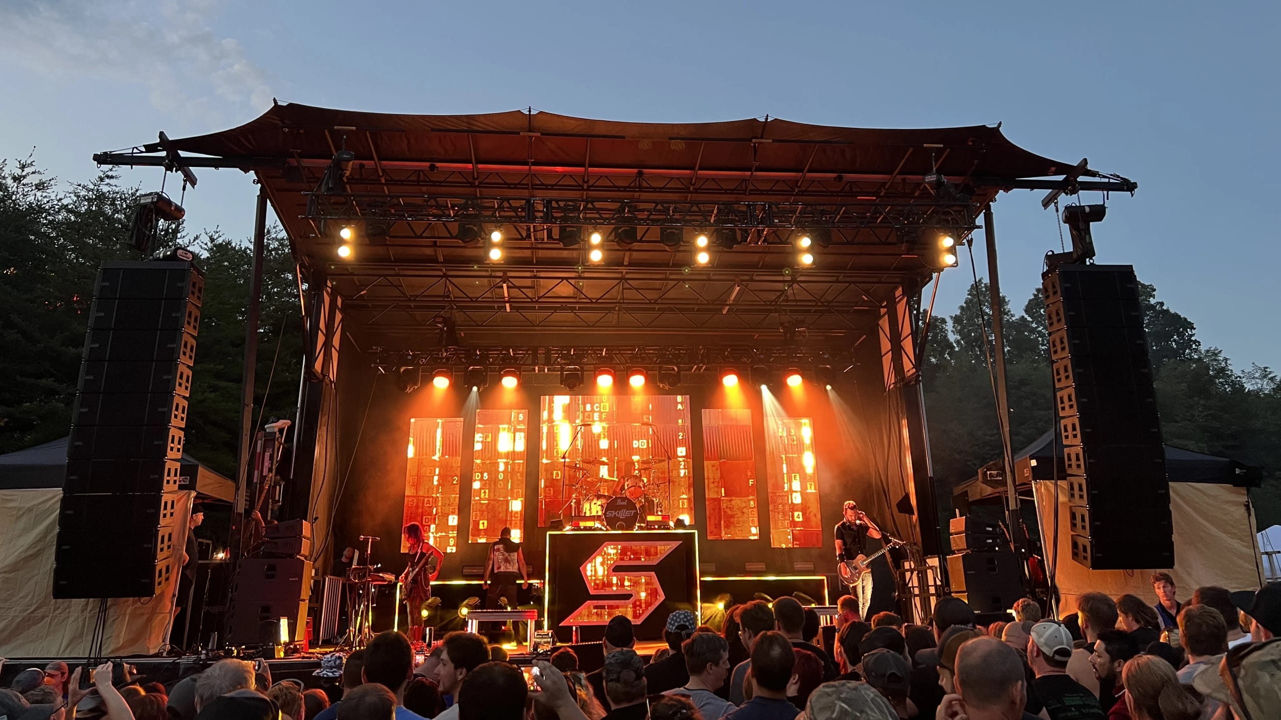 Atlanta event production — stage lighting with concert beams over a crowd