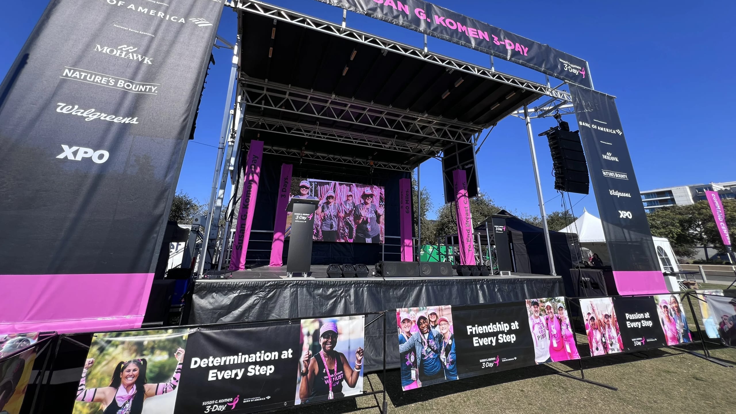Outdoor race event production with mobile stage, LED video wall, and course audio