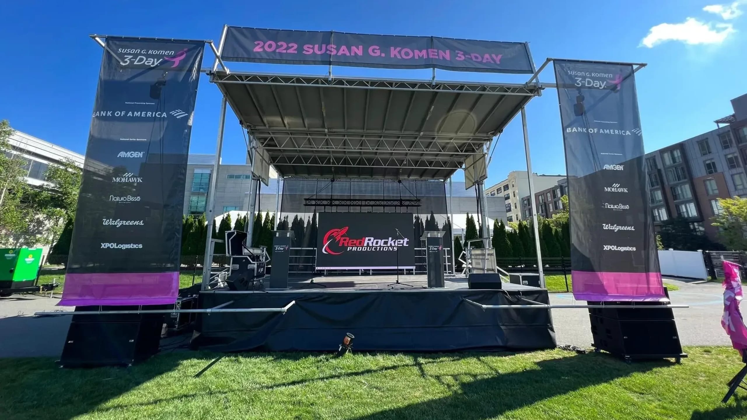 Stageline SL100 mobile stage front view with lighting and PA array