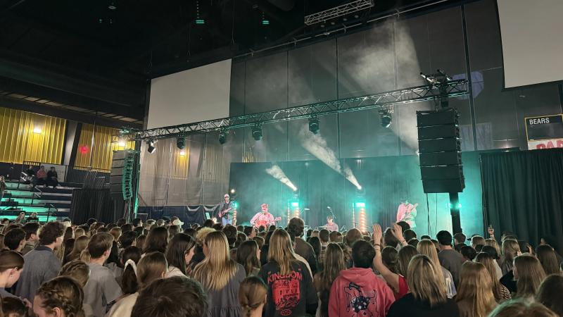Arena stage with moving head beam and truss rig