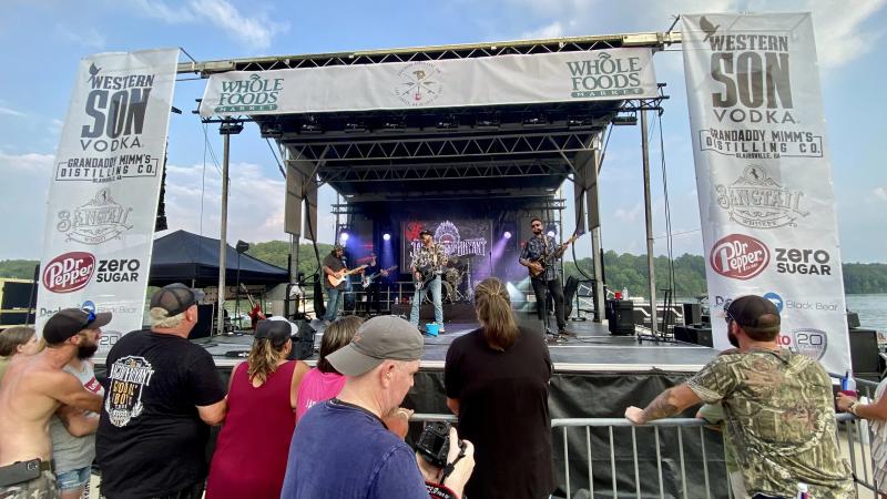 SL100 mobile stage with PA system and light truss over crowd