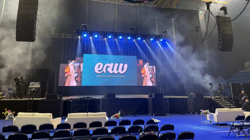 Corporate conference general session with LED video walls and staging