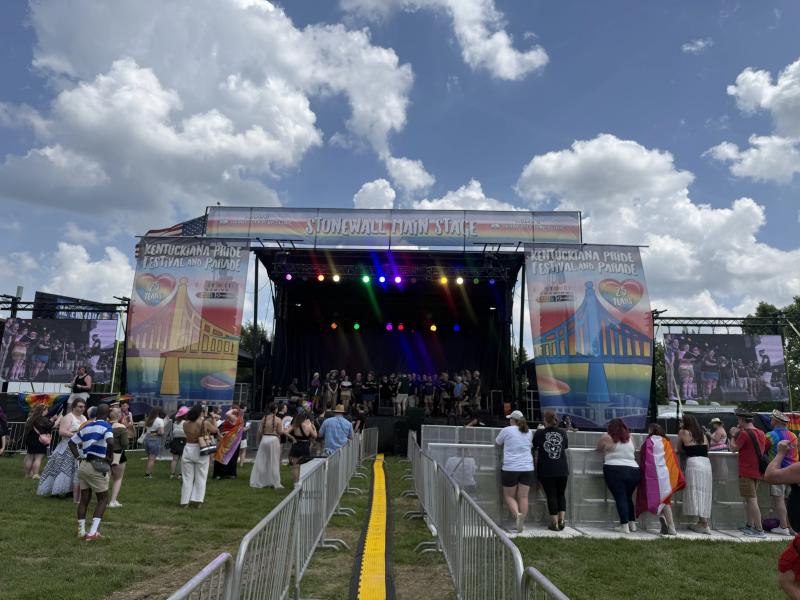 Outdoor concert with full staging, line arrays, and lighting