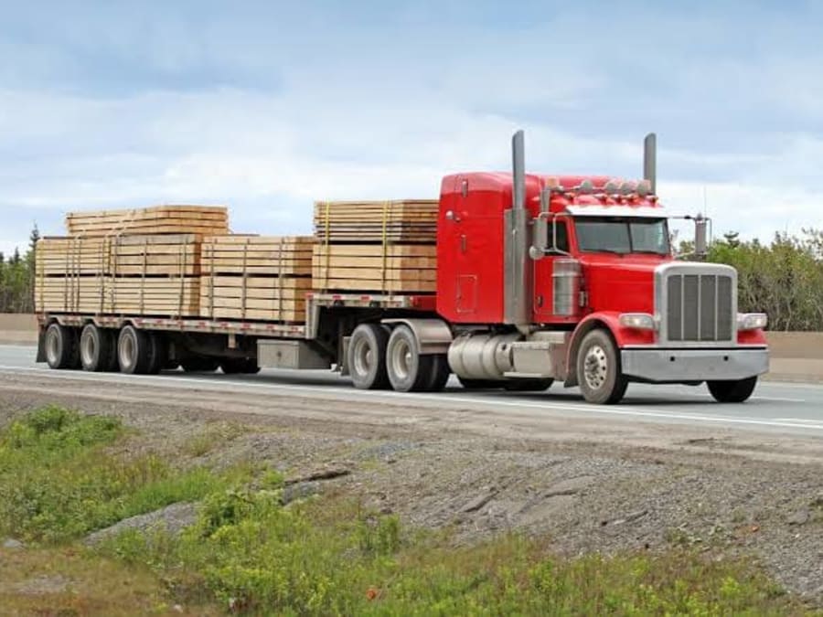 Truck making multiple construction supplier stops on a Tampa Bay delivery route