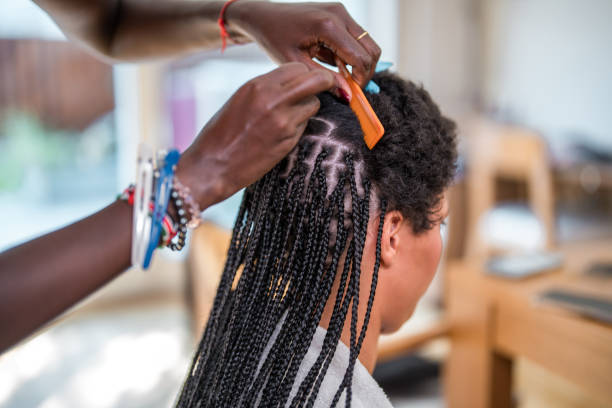 Hair braiding is one of the 30 side hustles for Africans in the US that pay well