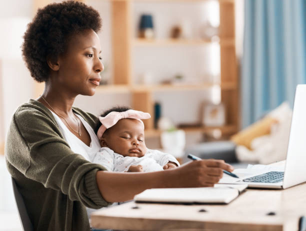 A stay-at-home mom working on her laptop as a social media manager