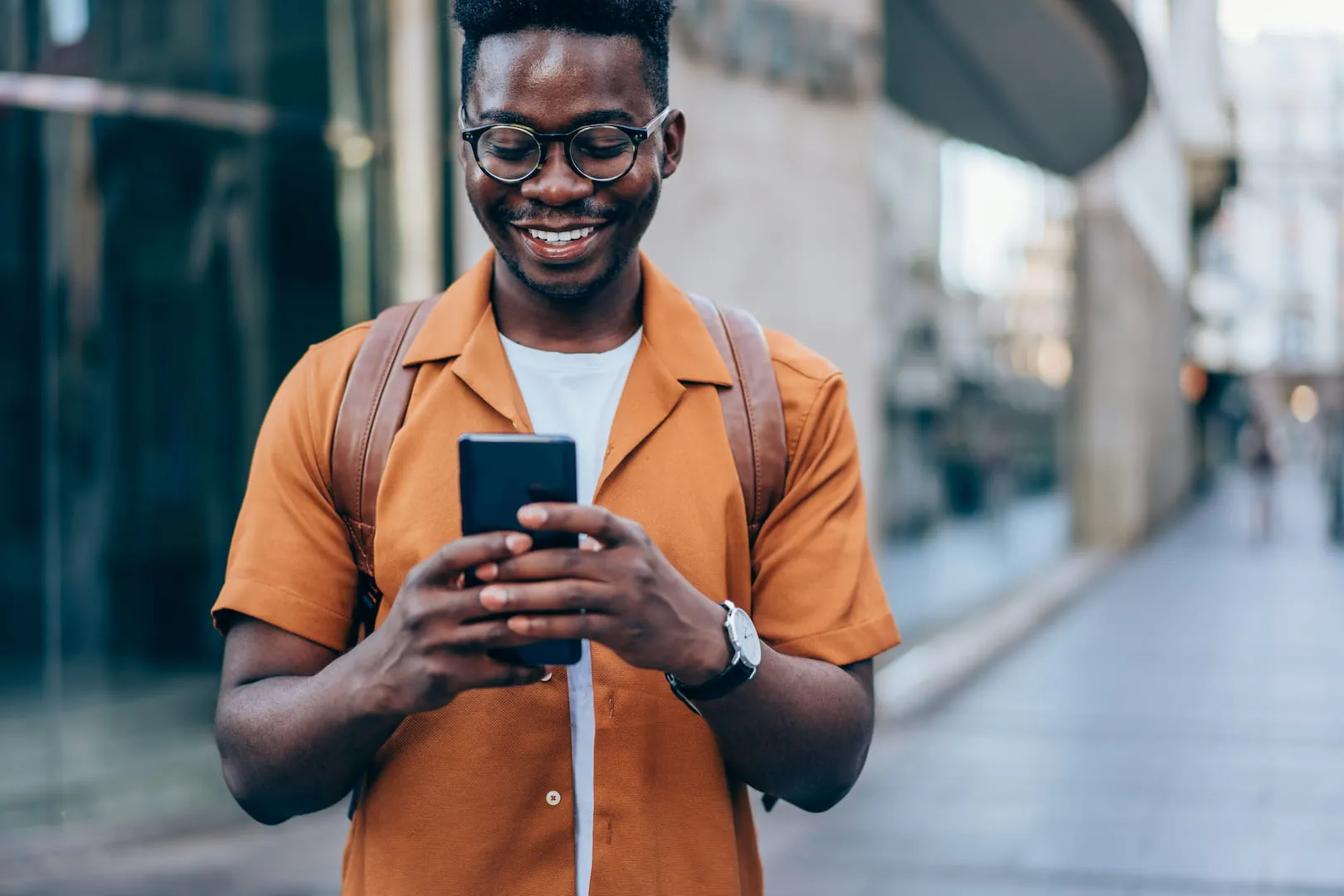 A young man sends money home with Accrue