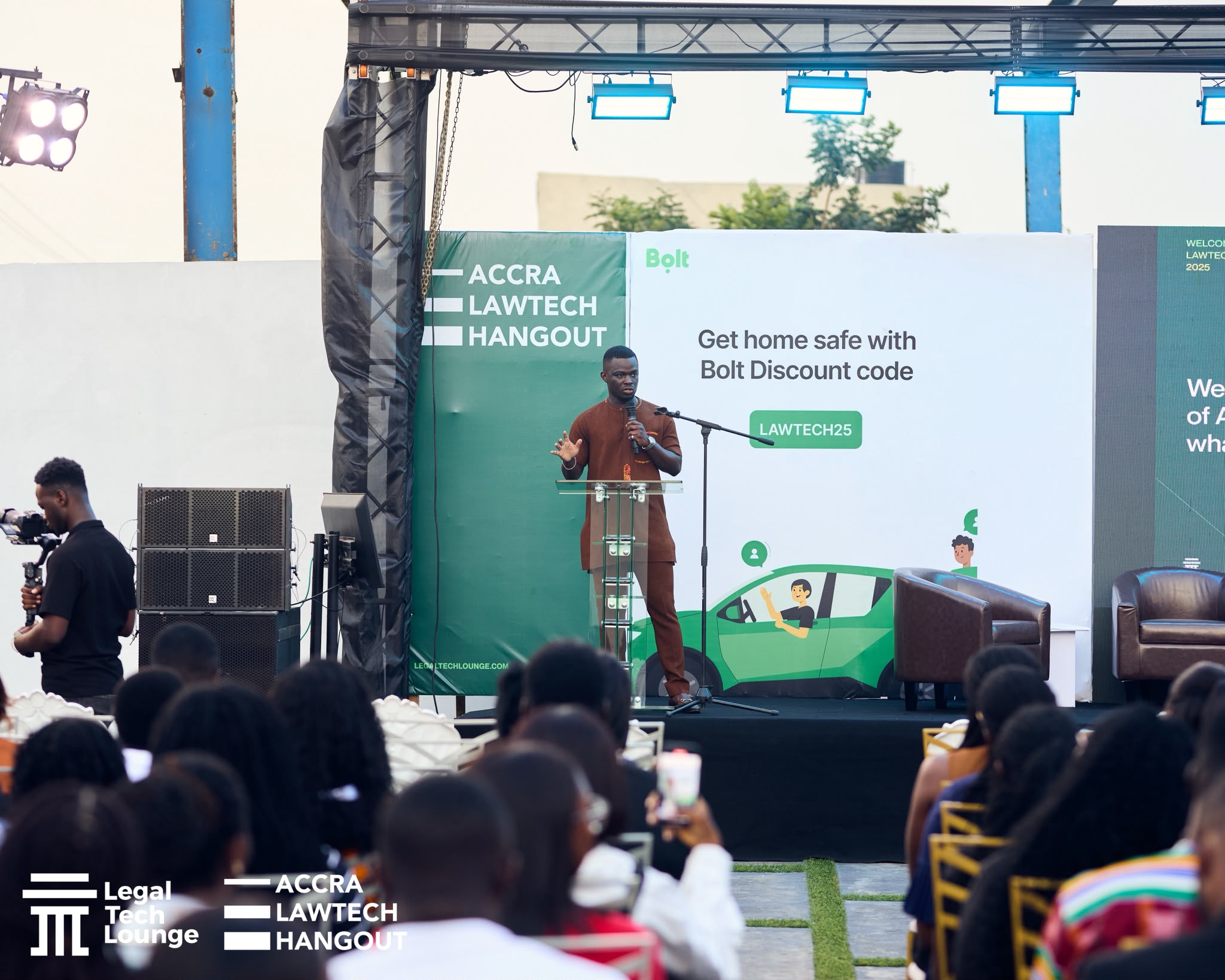 Michel Nkansah speaking on stage