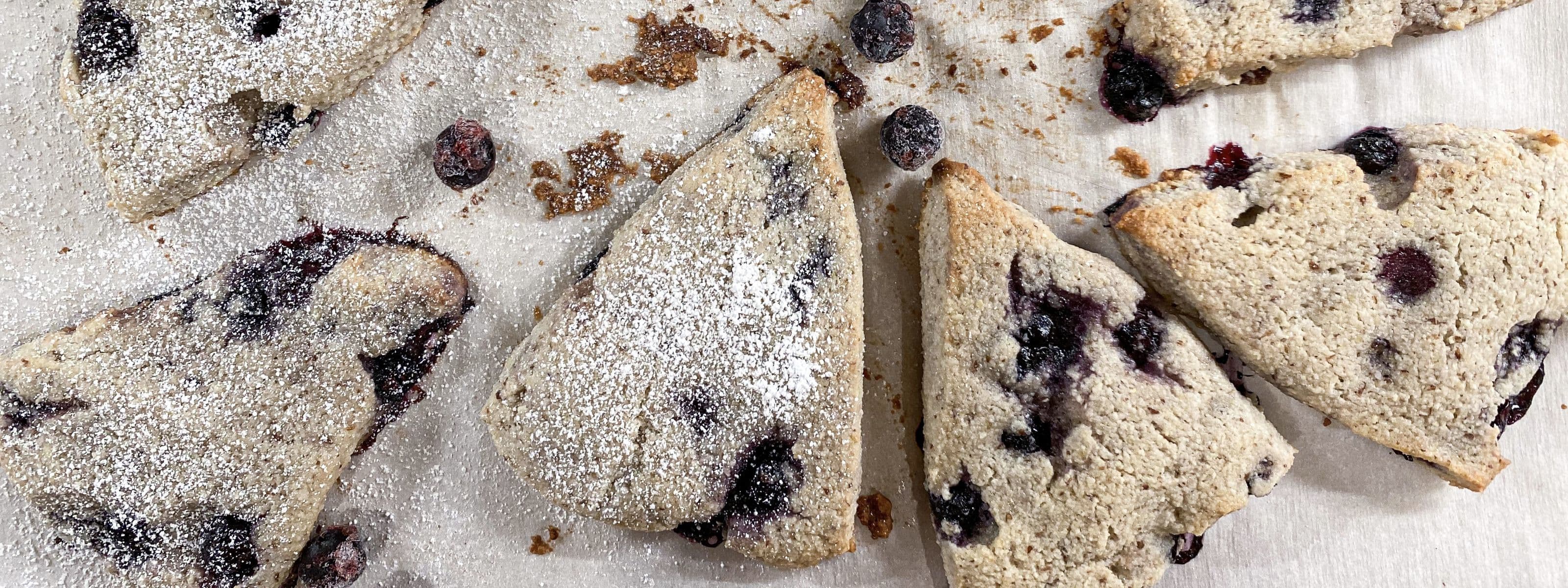 Blueberry scone on white plate