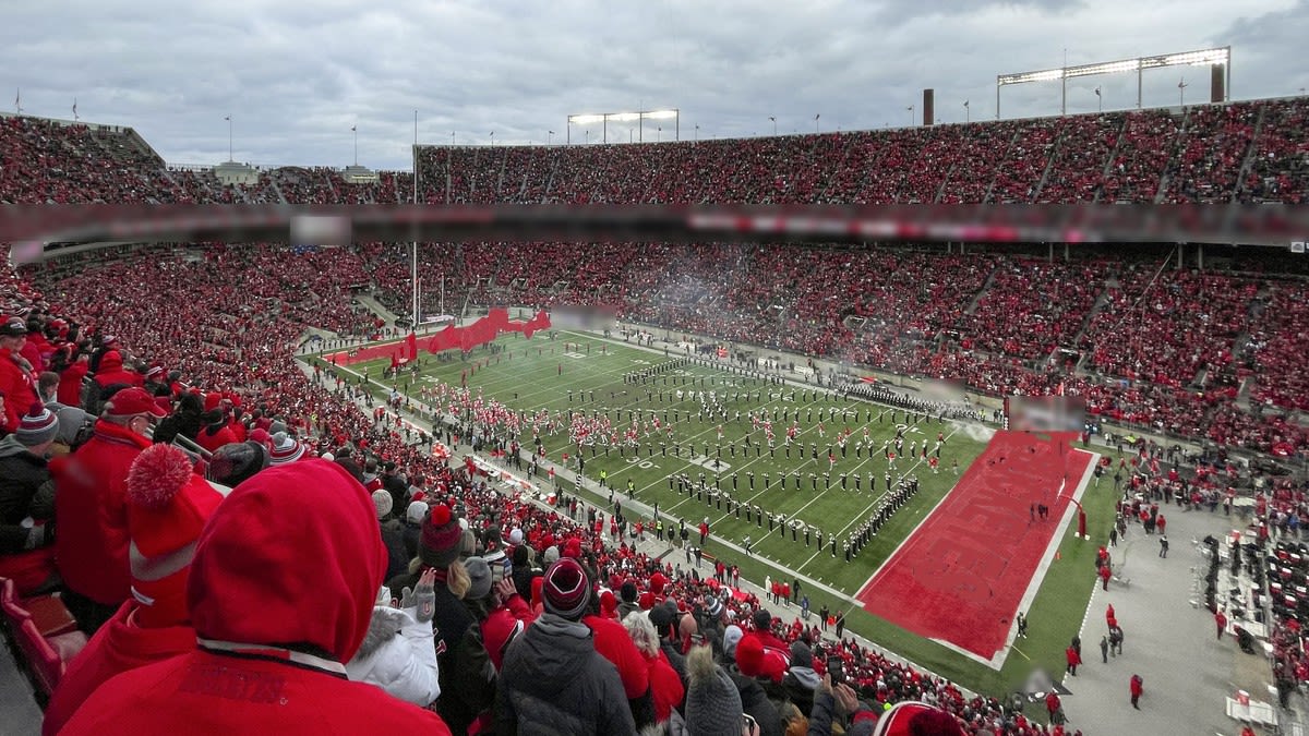 Fans in red fill Ohio Stadium in Columbus as the marching band performs on the field