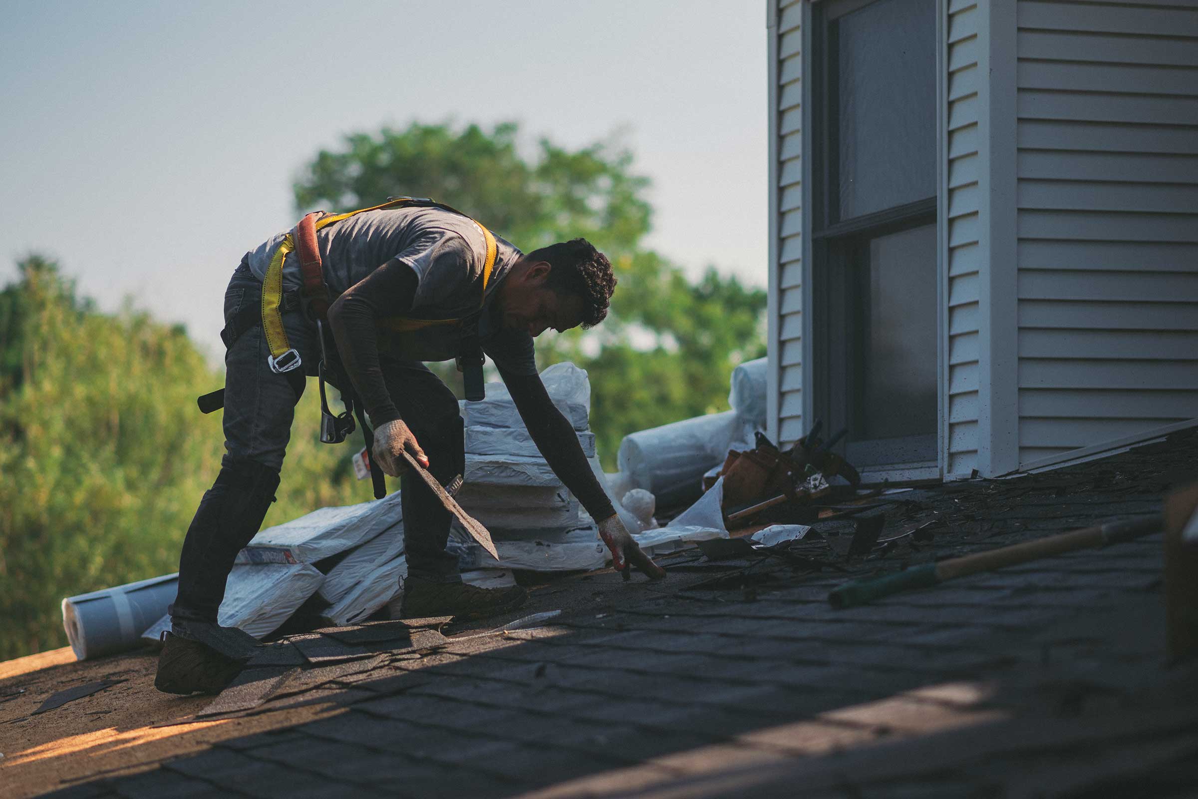 Roofing contractors repairing a roof