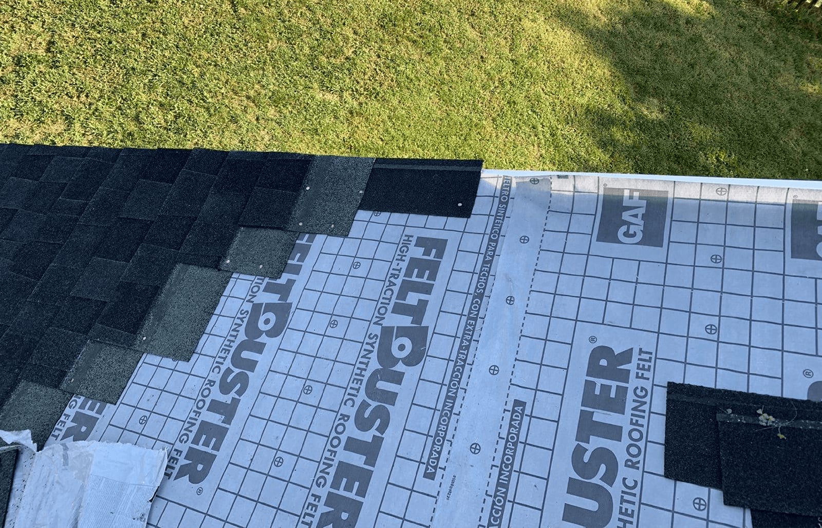 Roofsimple working on roof installing new roofing system for S. Talasky
