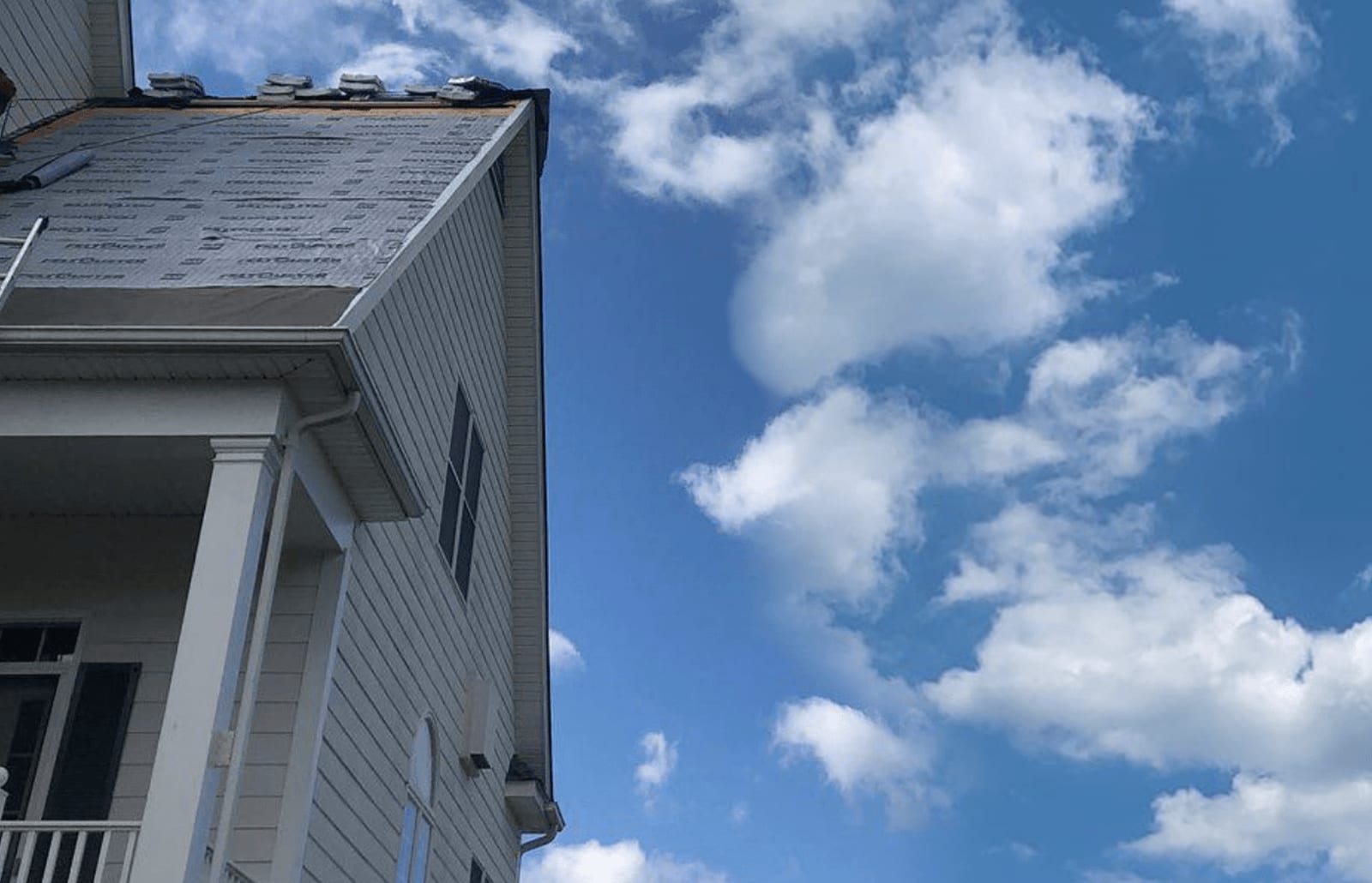 Roofsimple working on installing a new roofing system for Jim Ingle