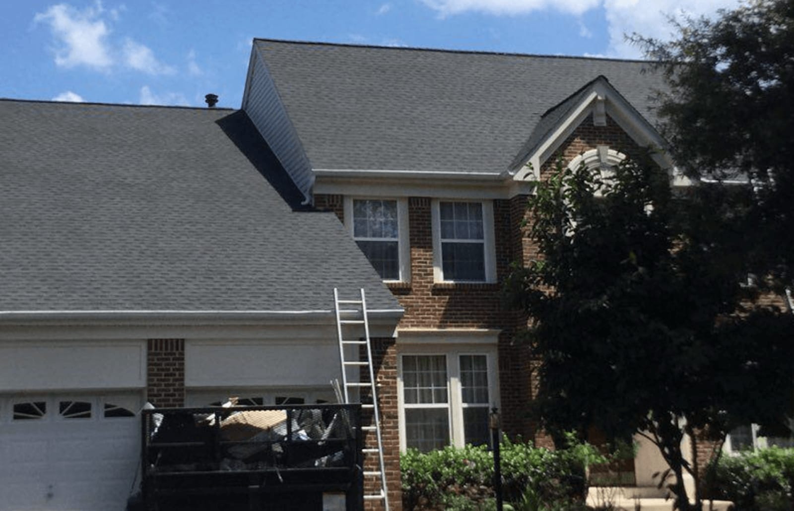 Roofsimple working on roof installing new roofing system for Ben McCarthy