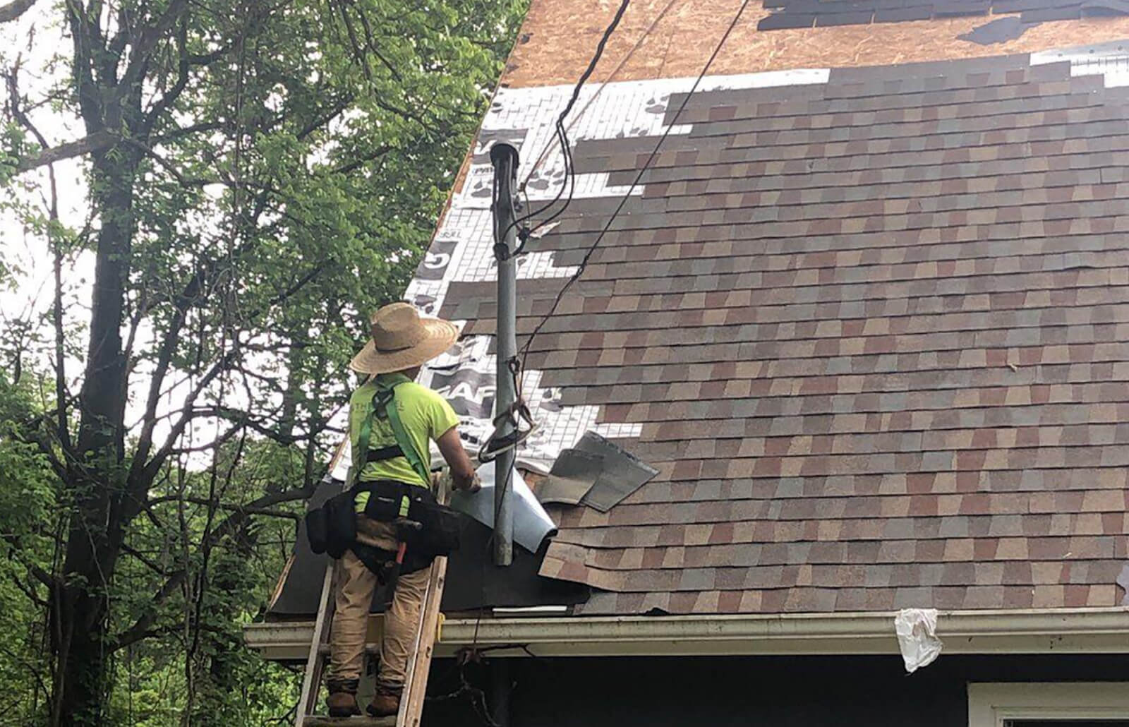 Roofsimple working on roof installing new roofing system for August Karl Ponstingel