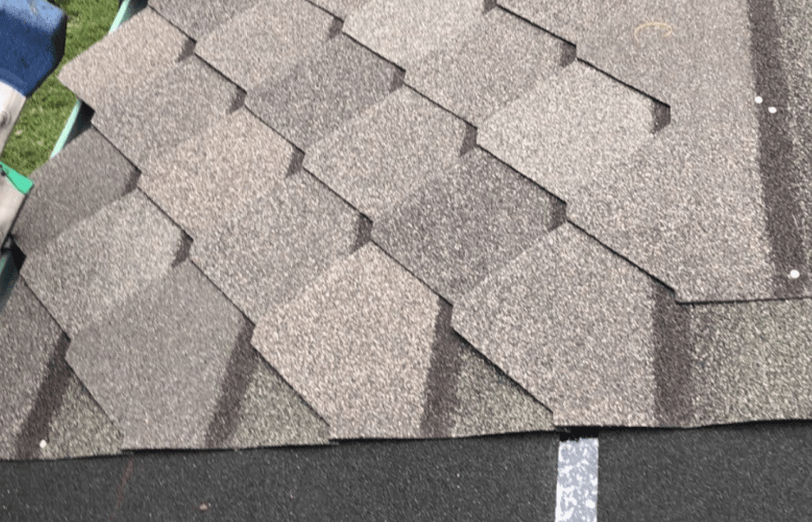 Roofsimple working on roof installing new roofing system for Tina Scogin