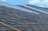 Roofsimple working on roof installing new roofing system for Charles Courtney