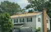 Roofsimple workers on roof installing new roofing system for Elizabeth Schloemer 