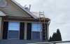 Roofsimple working on roof installing new roofing system for Jamie Giza
